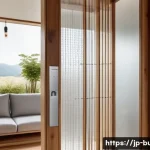 건물 보안 강화 방법 - A modern Japanese home entrance featuring a sleek smart lock system integrated with a smartphone app...